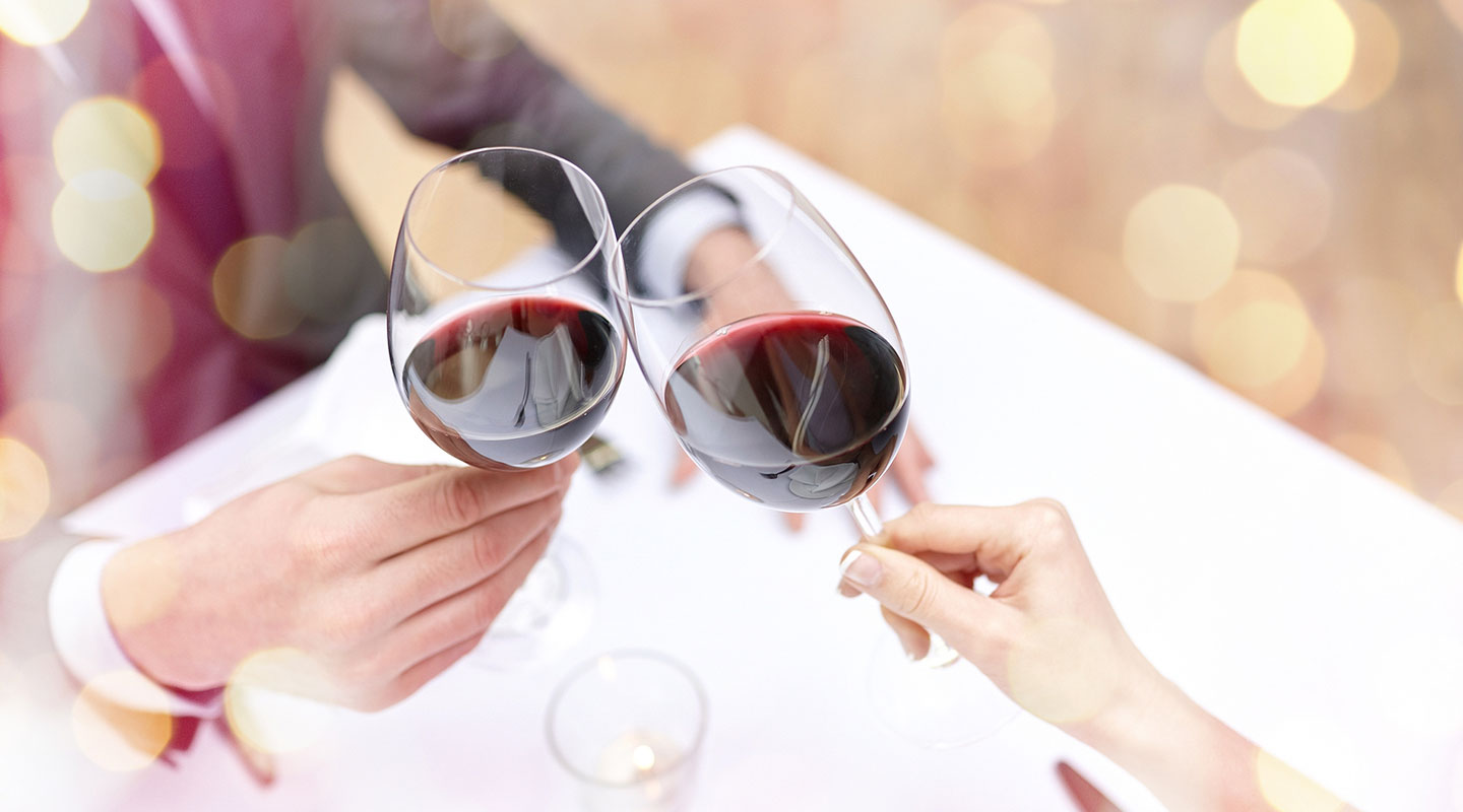 Couple Toasting with Red Wine